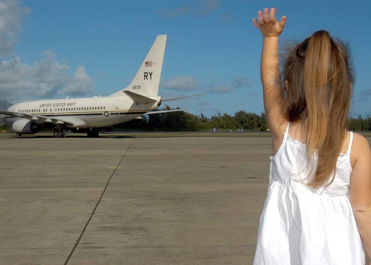Little girl waves goodbye to RY plane